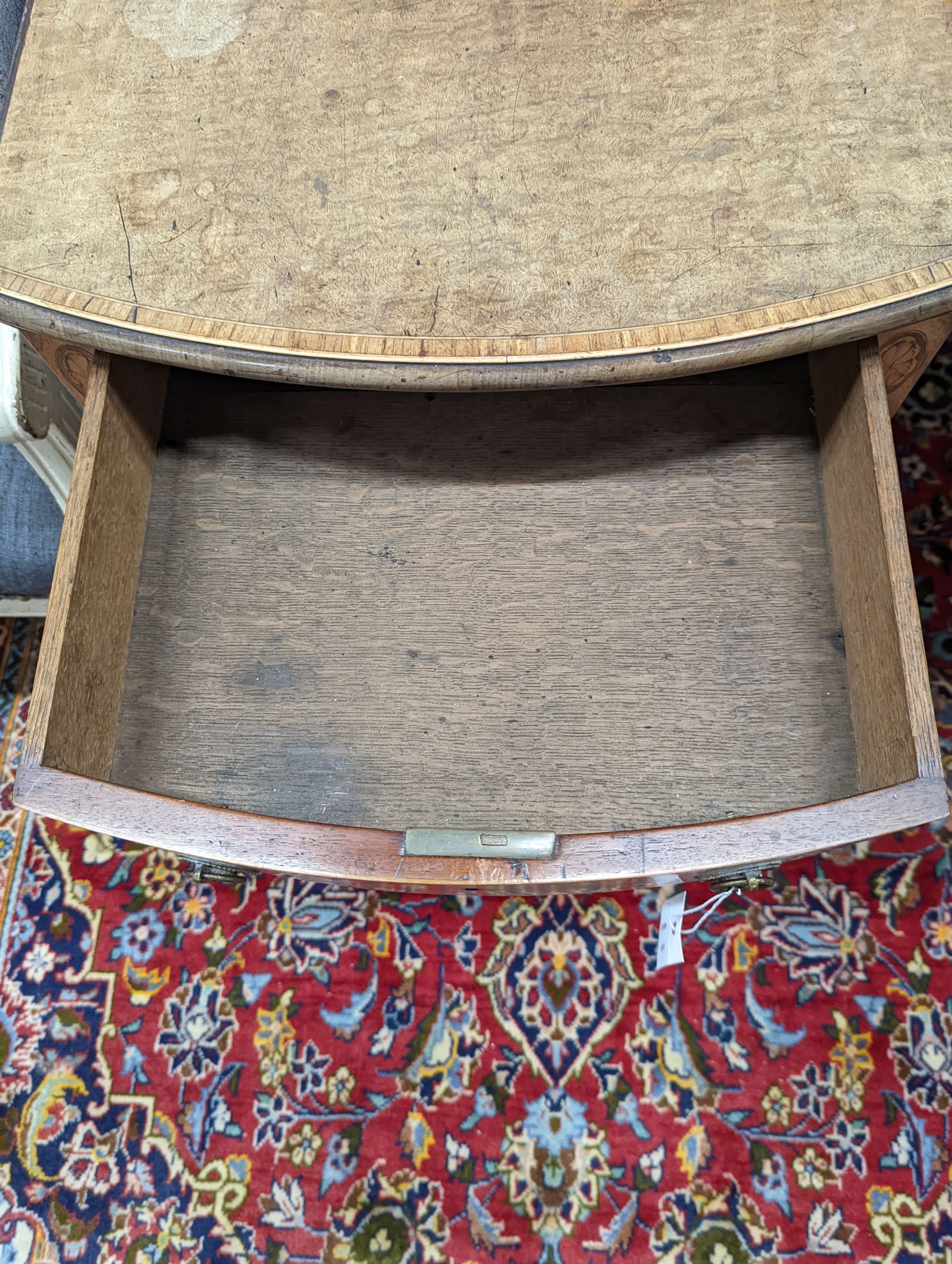 A George III satinwood banded mahogany oval topped Pembroke table, width 48cm, depth 70cm, height 71cm